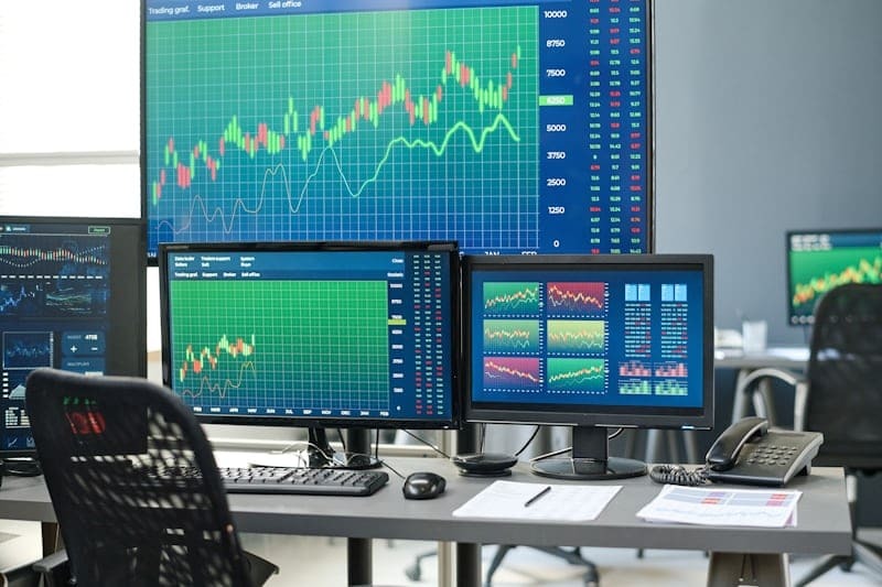 "Stock market analysis and finance trends on trading screens"